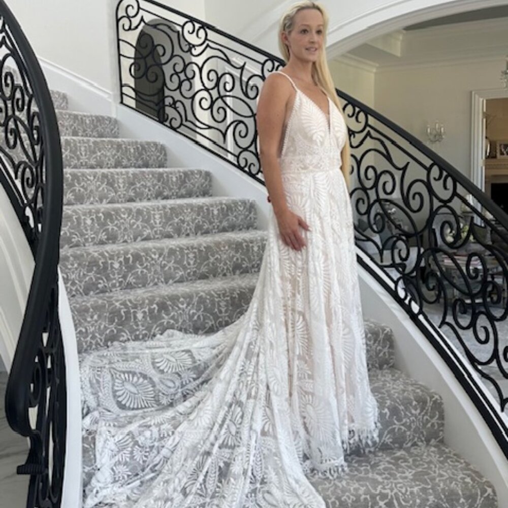 Exquisite white on beige, lace wedding dress